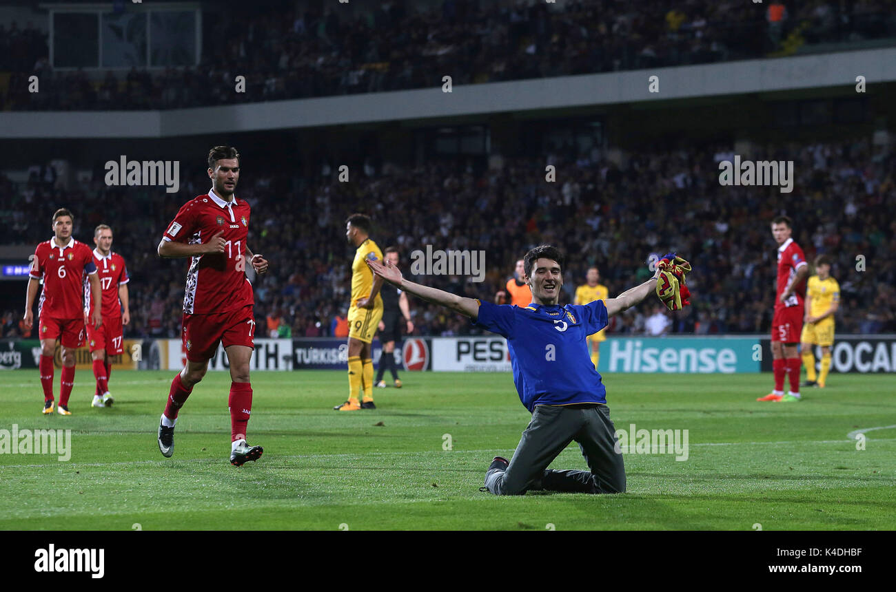 A member of the crowd encroaches onto the pitch during the 2018 FIFA World Cup Qualifying, Group D match at Stadionul Zimbru in Chisinau, Moldova. Stock Photo