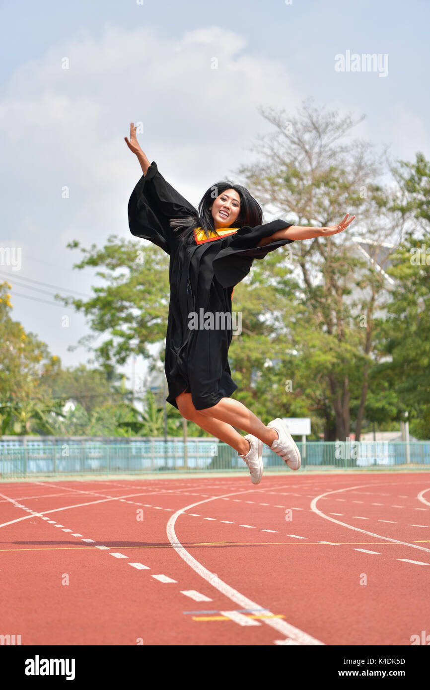 Portrait of asian cute women graduate of university. Stock Photo