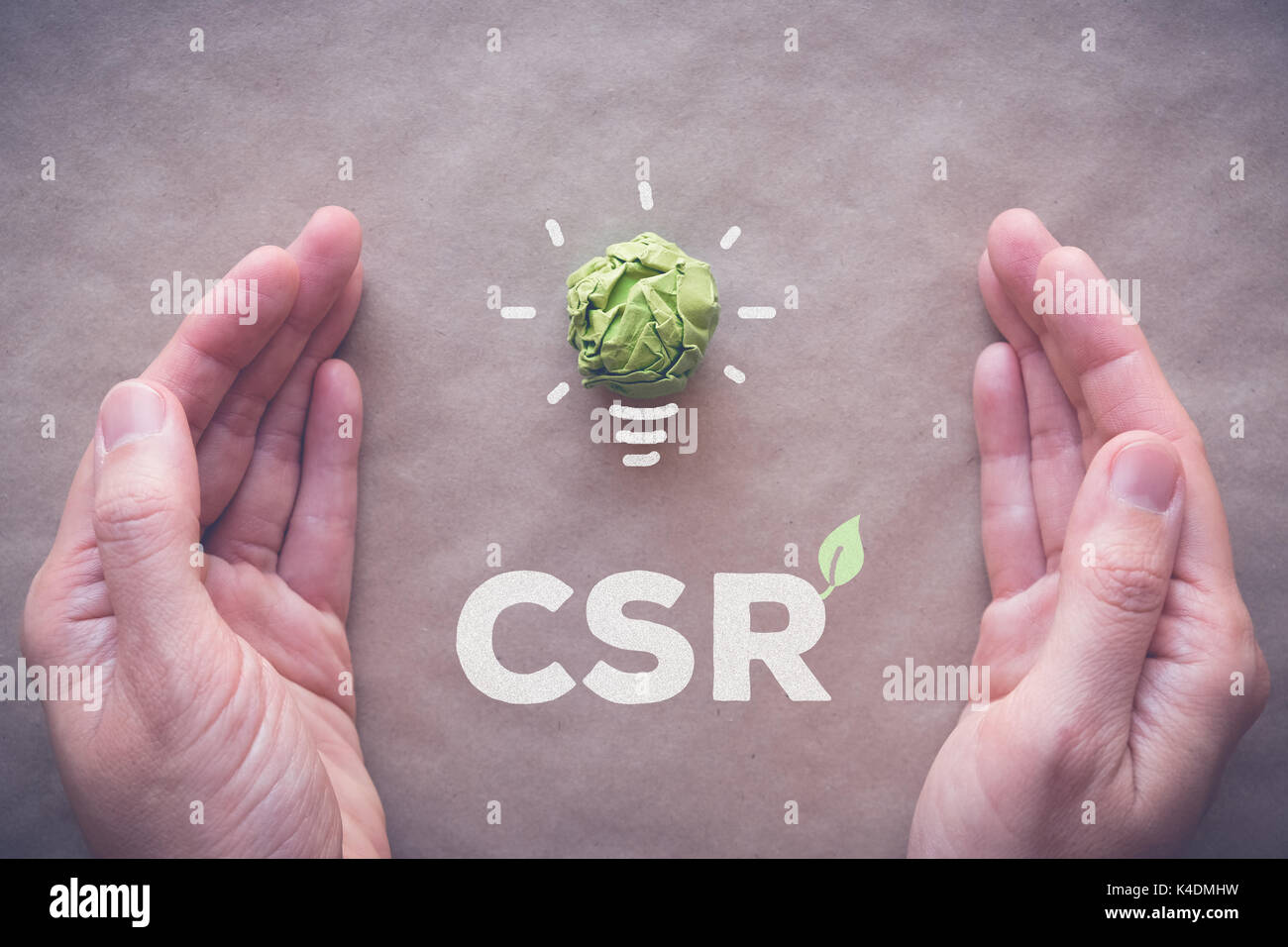 Green paper light bulb with CSR, Corporate social responsibility Stock ...