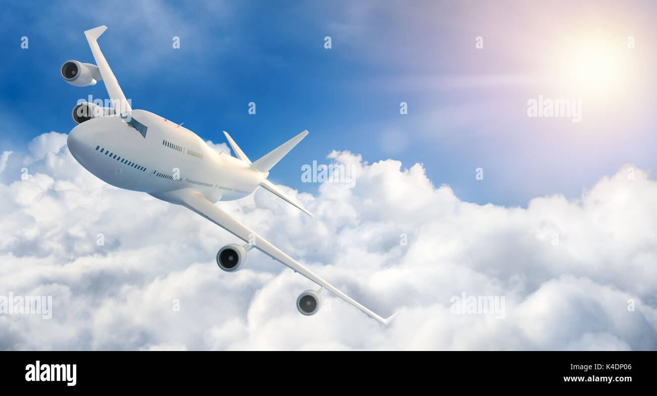 Airplane flying above clouds Stock Photo