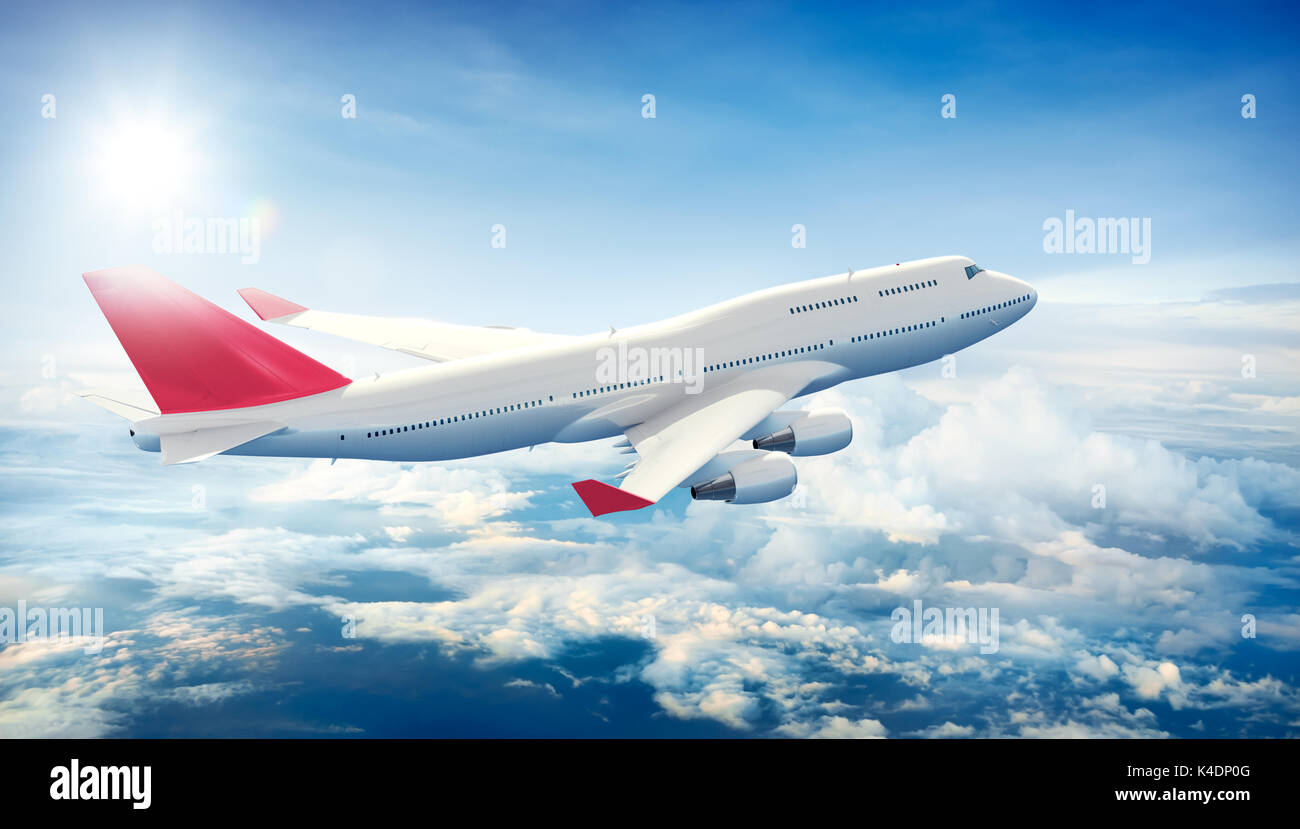 Airplane flying above clouds Stock Photo