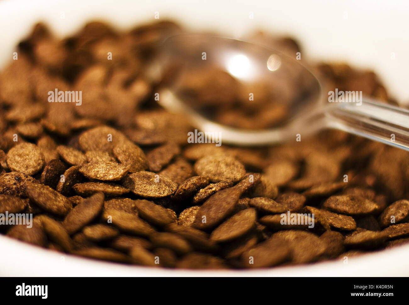 Chocolate flakes with spoon for breakfast. Selective focus. Stock Photo