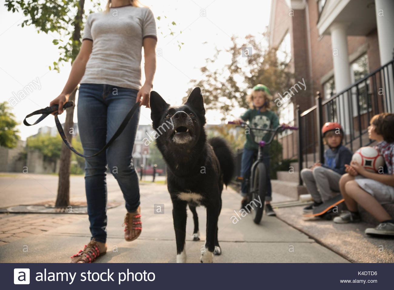 Woman walking on the sidewalk hires stock photography and images Alamy