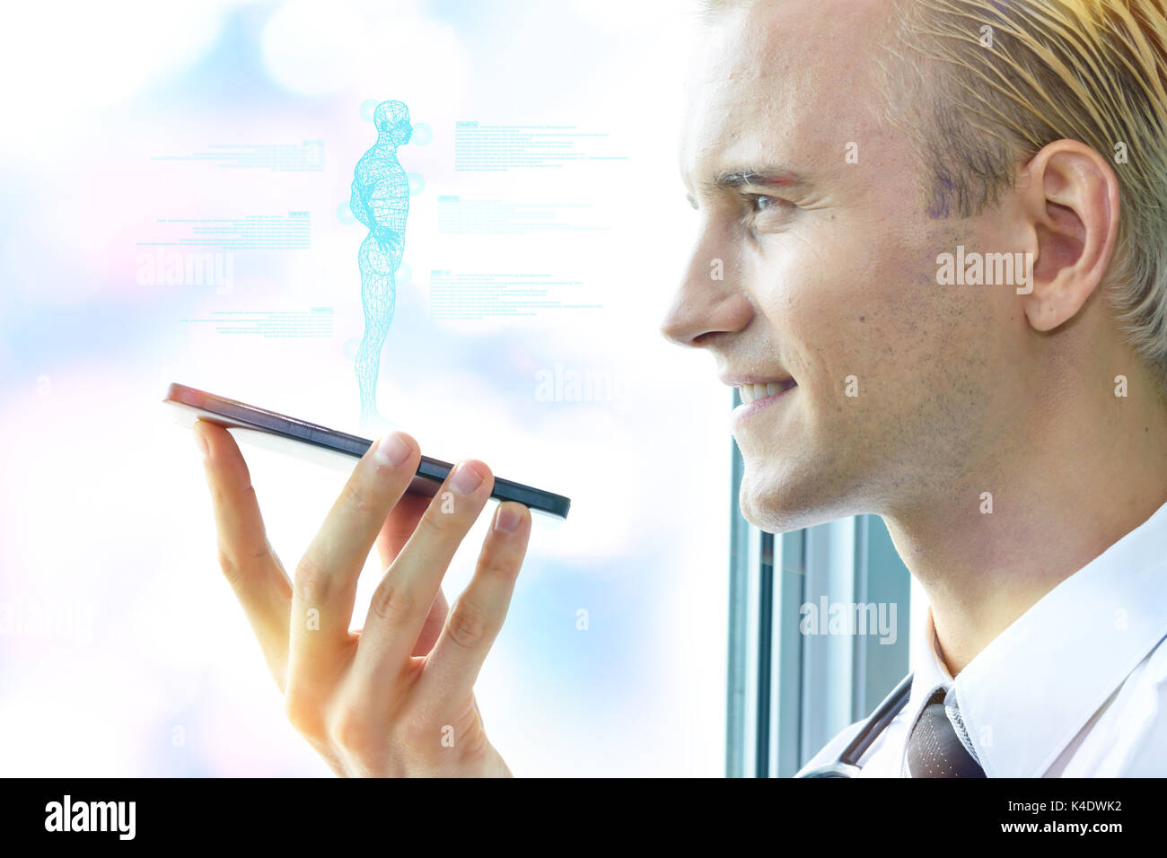 Artificial intelligence hologram robot adviser technology concept.Male doctor use smartphone ai wireframe popup screen application for ask question or Stock Photo