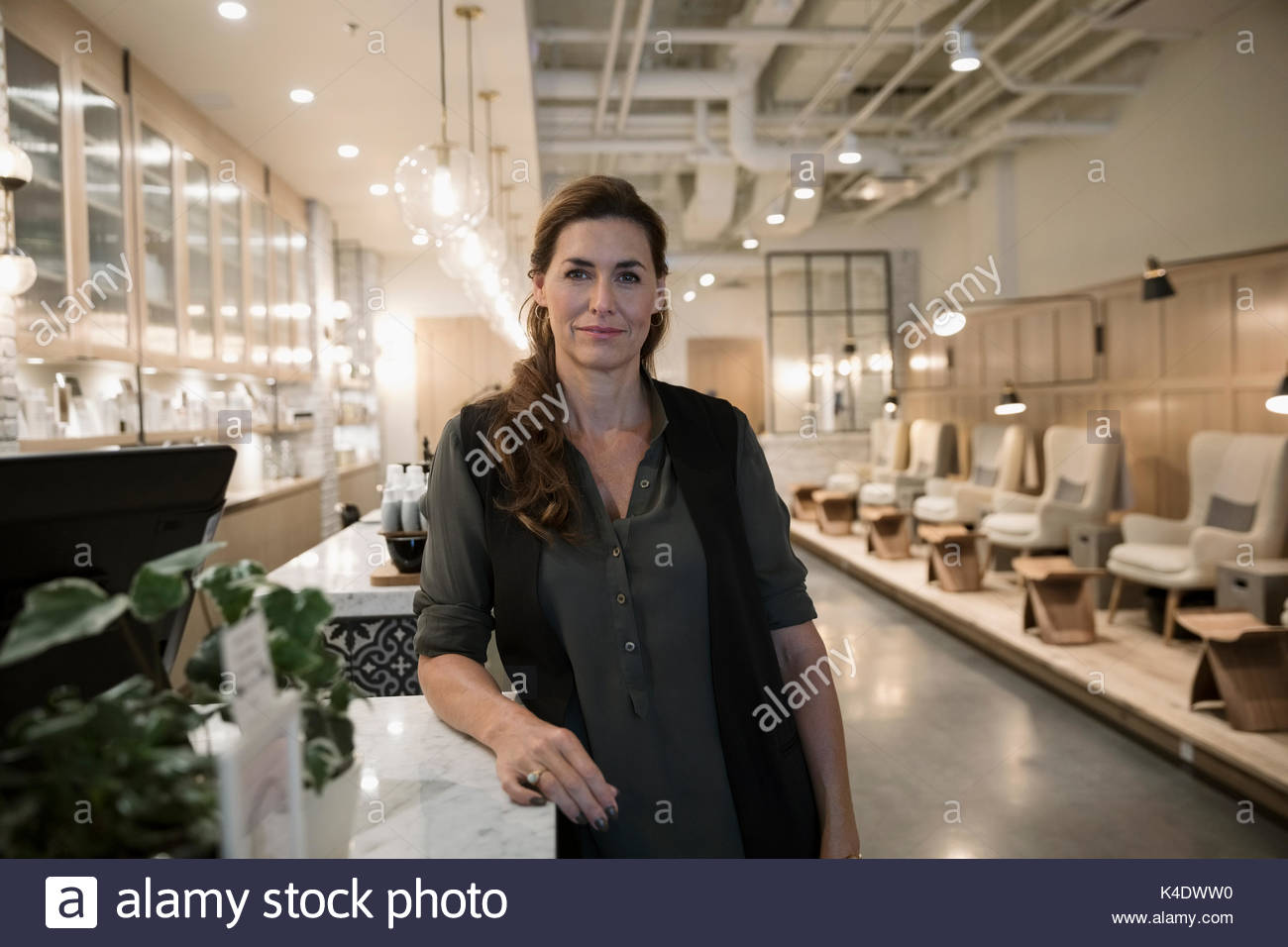 Portrait smiling, confident female nail salon owner Stock Photo Alamy