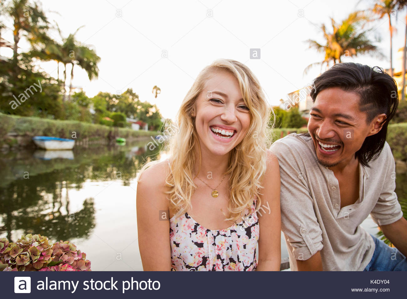 Portrait laughing couple at summer lake Stock Photo