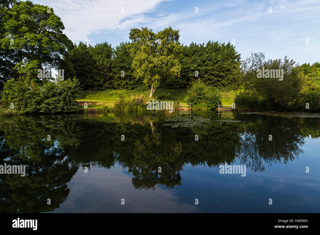 Loch Neaton in the heart of the town of Watton in central Norfolk, captured early one morning after sunrise. Stock Photo