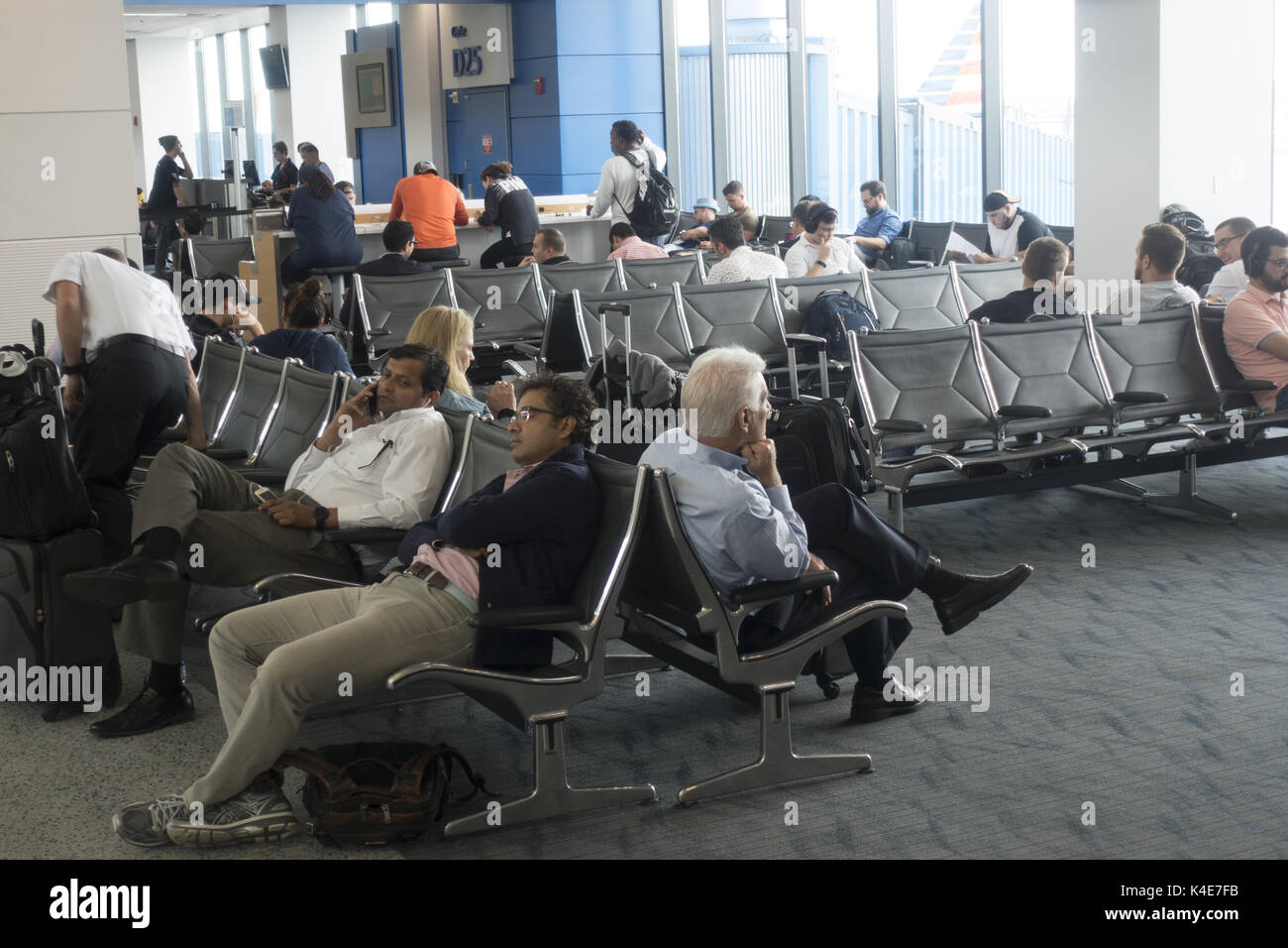 Travelers wait for the boarding time at Detroit Metropolitan Airport in