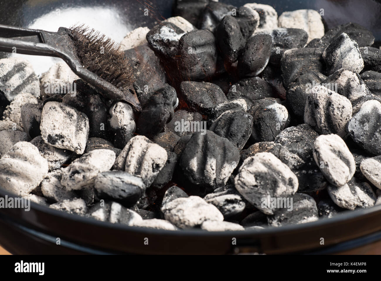 Closeup of BBQ grill pit hot charcoal briquettes, food Background or