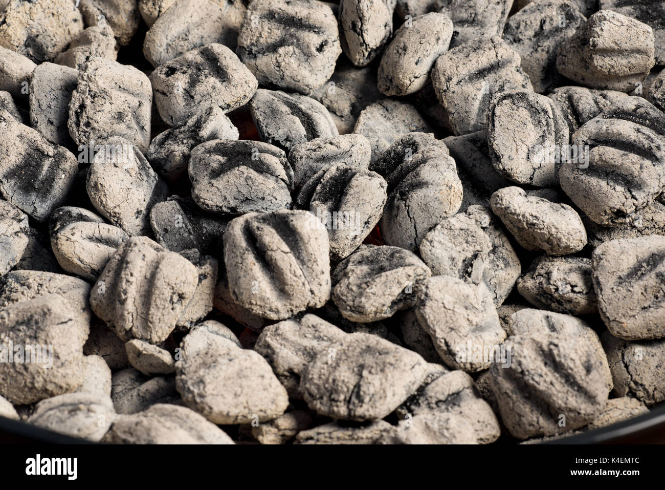 Closeup of BBQ grill pit hot charcoal briquettes, food Background or