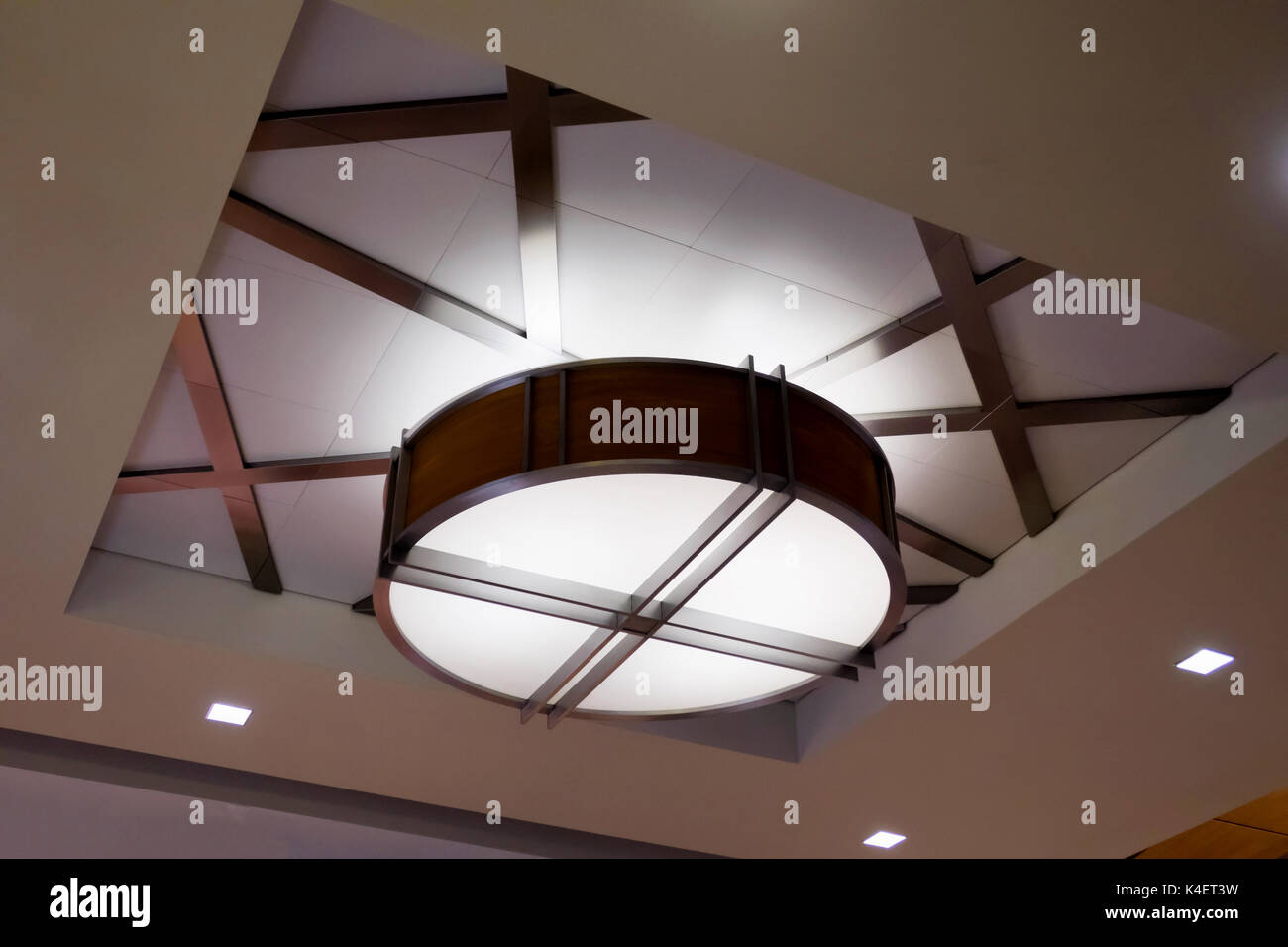 A circular modern light fixture in the ceiling Stock Photo Alamy