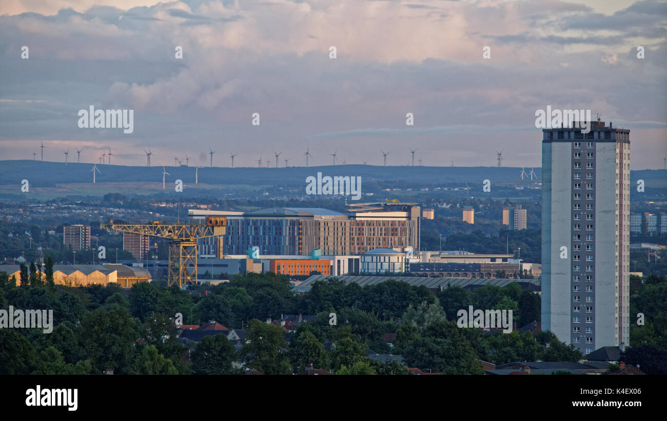 Glasgow Queen Elizabeth University Hospital near sunset known as the Death Star.Helicopter on pad Barclay Curle crane a Clyde titan in the foreground Stock Photo