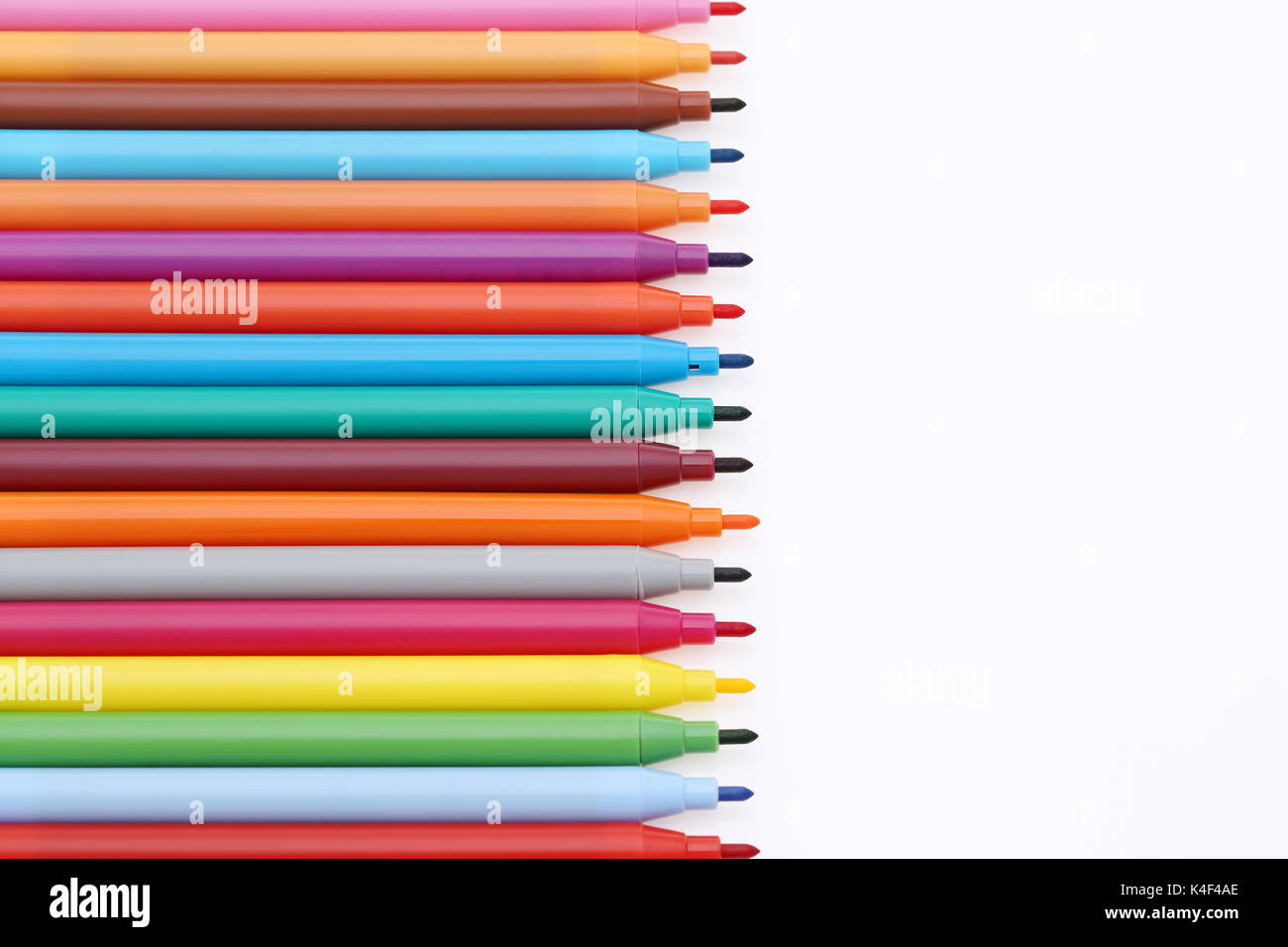 row of colorful pens for painting or drawing on white background Stock Photo