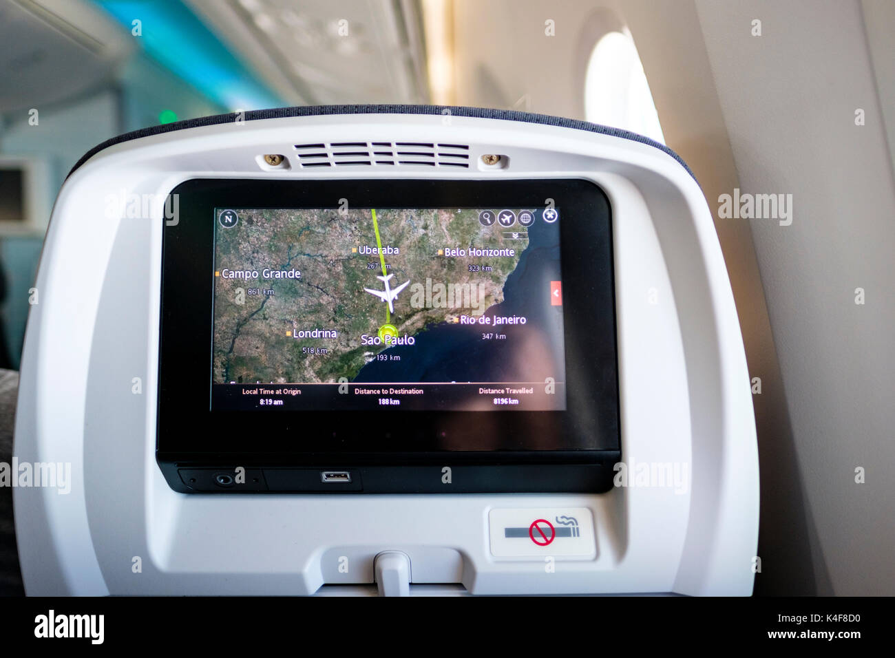 Air travel, Boeing 787 headrest screen showing destination information, route map, airplane arriving in Sao Paulo, Brazil Stock Photo