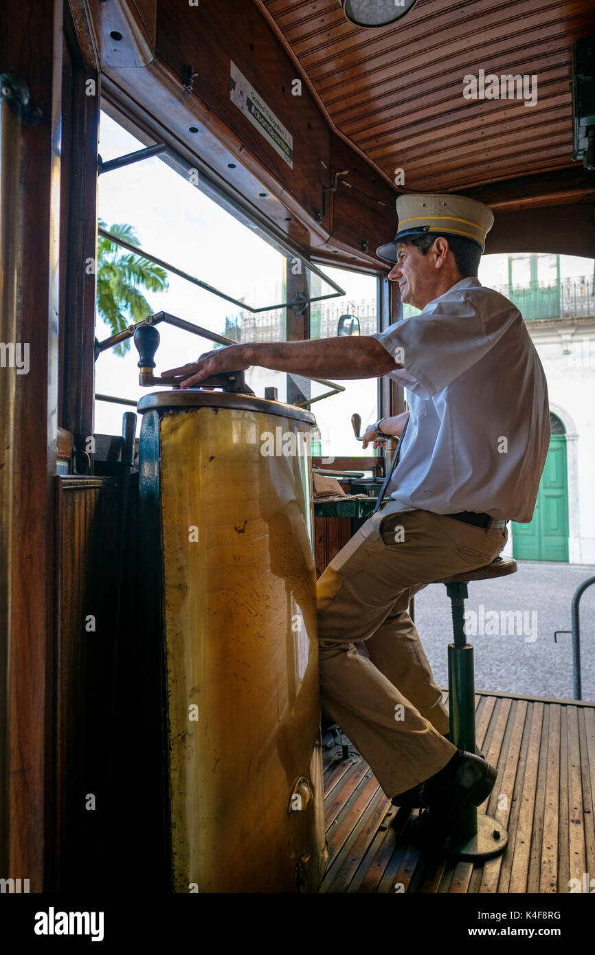 Male conductor of a restored 1911 historical streetcar posing for a portrait in the city of Santos, State of Sao Paulo, Brazil. Stock Photo