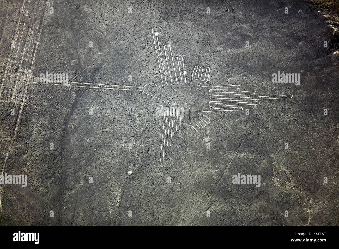 The Hummingbird, Nazca Lines, (ancient geoglyphs and World Heritage Site) in the desert near Nazca, Ica Region, Peru, South America - aerial Stock Photo
