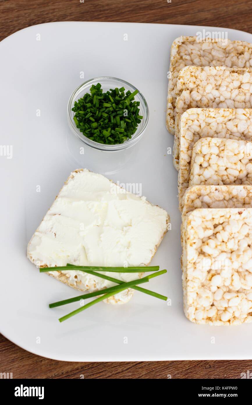 Rice cakes with cream cheese and chives Stock Photo - Alamy