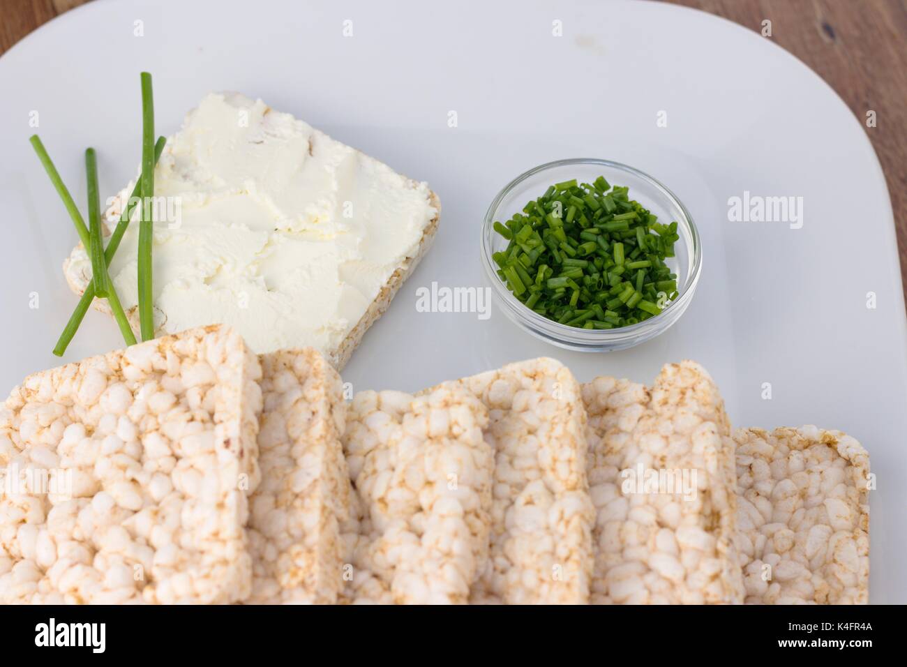 Rice cakes with cream cheese and chives Stock Photo Alamy