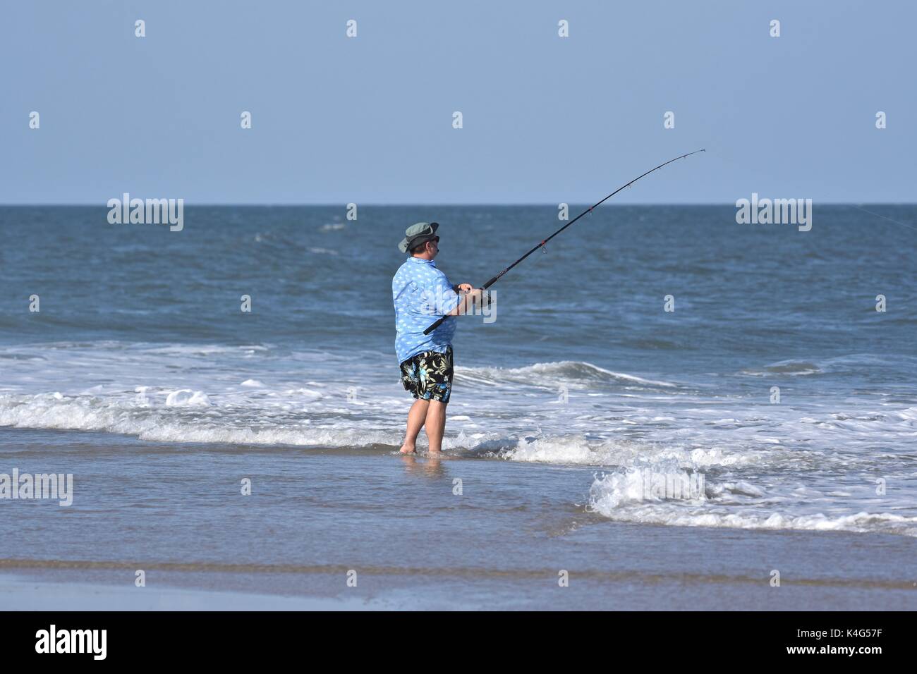 Surf fishing on the ocean shore Stock Photo Alamy