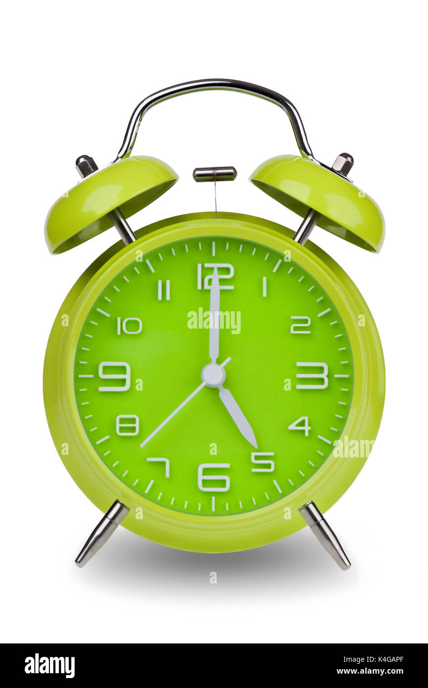 Green alarm clock with the hands at 5 am or pm isolated on a white background. One of a set of 12 images showing the top of the hour starting with 1 a Stock Photo