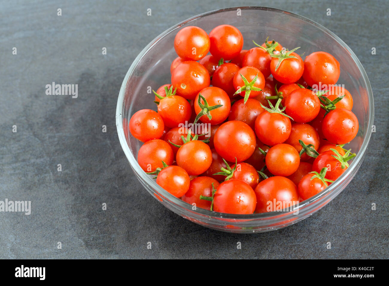 Fresh Cherry Tomato in the glass bowl Stock Photo - Alamy