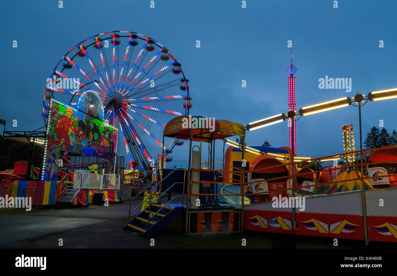 Hoosic Valley county Schaghticoke county fair with the lights, reflections, rides, on a rainy