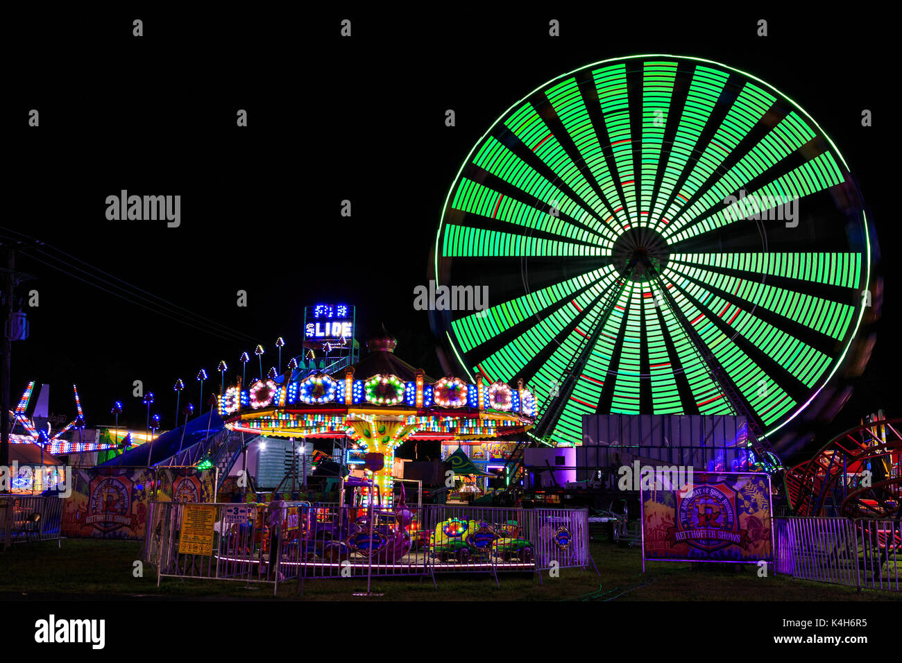 Hoosic Valley county Schaghticoke county fair with the lights, reflections, rides, on a rainy