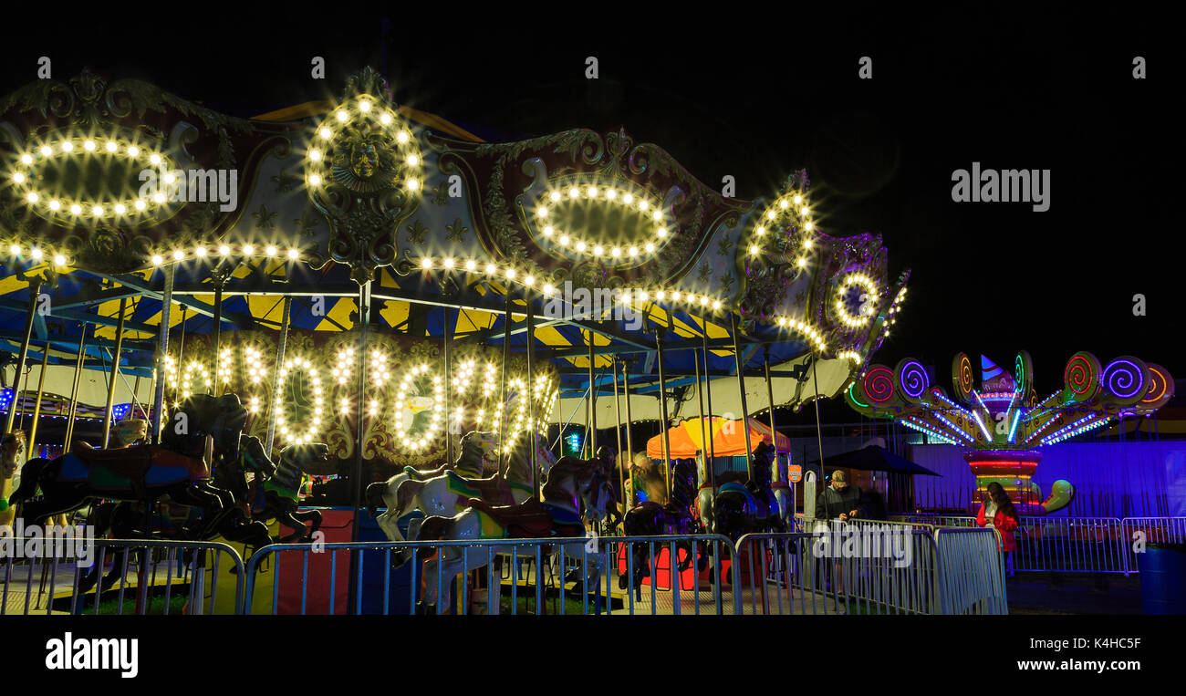 Hoosic Valley county Schaghticoke county fair with the lights, reflections, rides, on a rainy