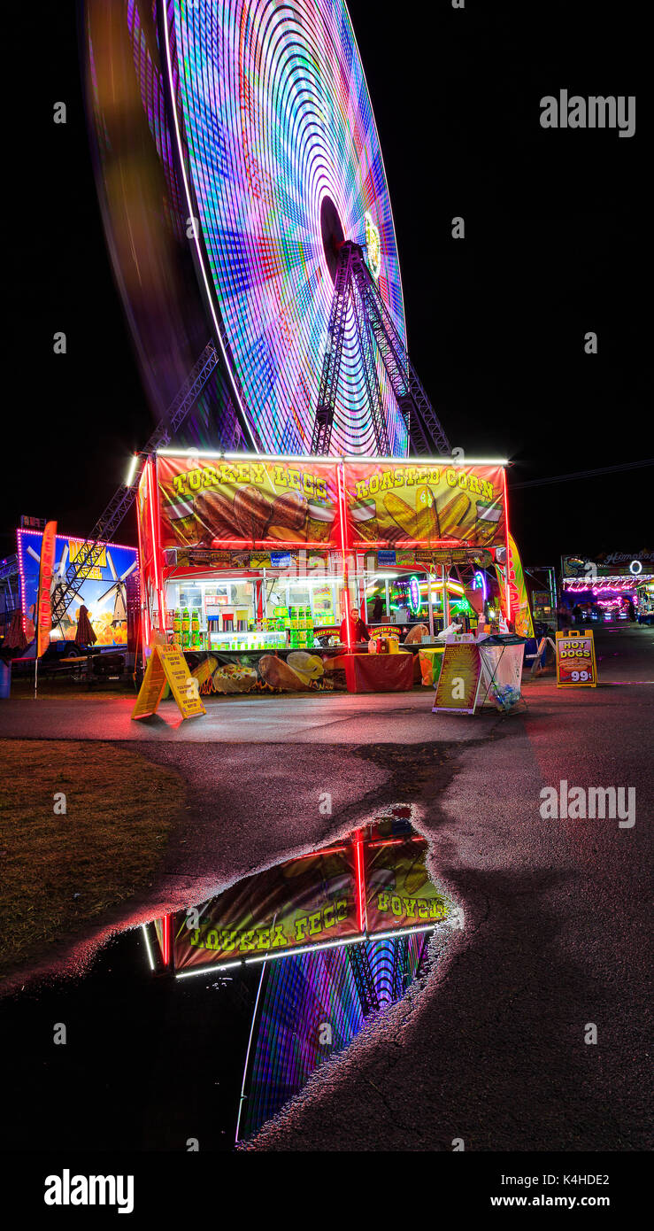 Hoosic Valley county Schaghticoke county fair with the lights, reflections, rides, on a rainy