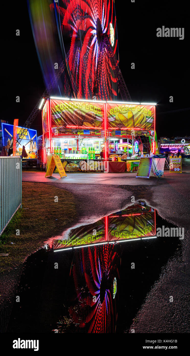 Hoosic Valley county Schaghticoke county fair with the lights, reflections, rides, on a rainy