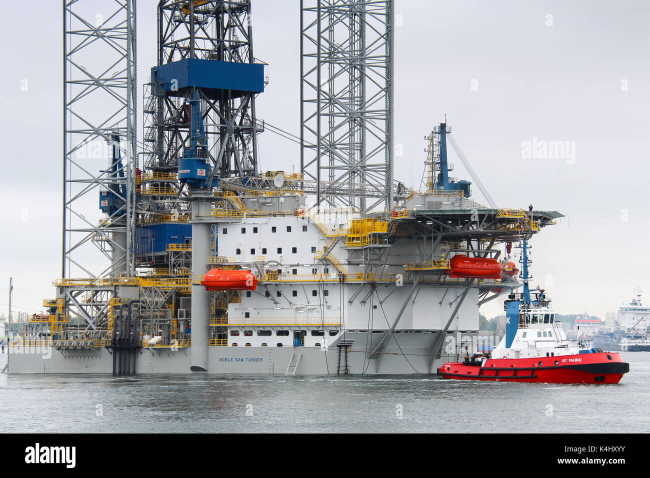 Caland Canal, Rotterdam, the Netherlands, May 29, 2014: The jack-up rig Noble Sam Turner is being towed by a Kotug tugboat Stock Photo
