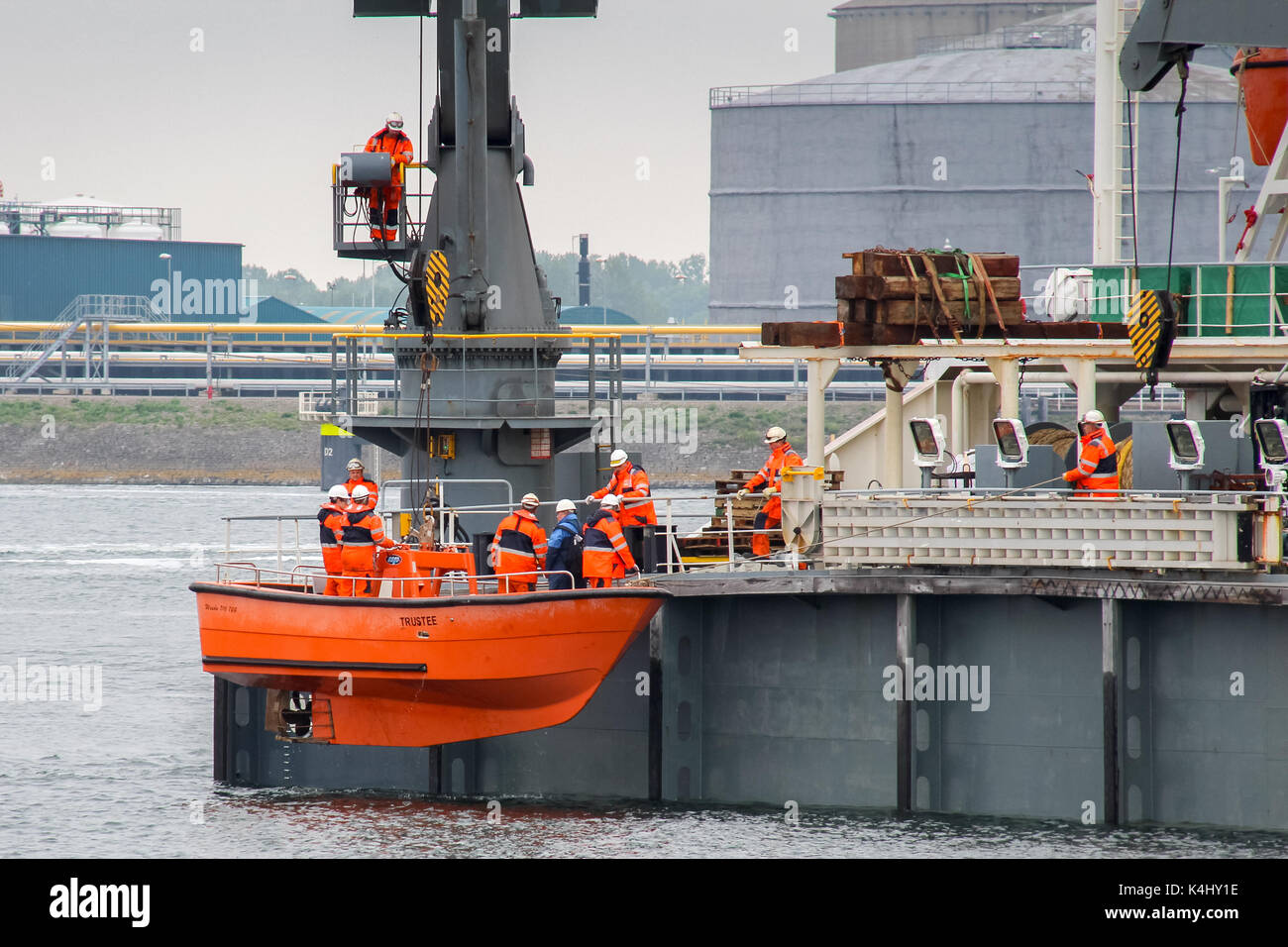 Caland Canal, Rotterdam, the Netherlands, May 29, 2014: The crew of the Dockwise semi-submersible ship Trustee is lifted back onboard in the workboat Stock Photo
