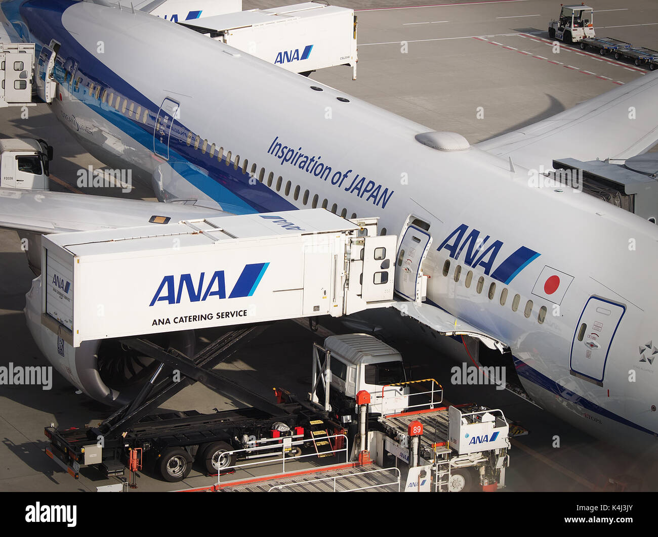 ANA Catering Service loading for ANA Boeing 787 Dreamliner at New Chitose Airport apron, Hokkaido, Japan Stock Photo