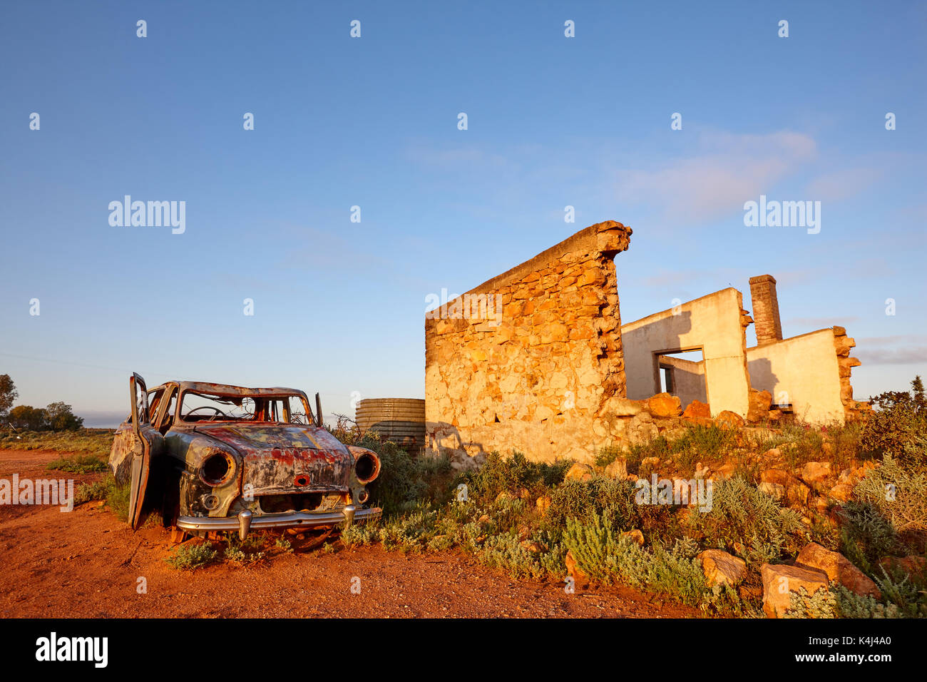 Early morning light on car and old building, Silverton, NSW, Australia. Stock Photo