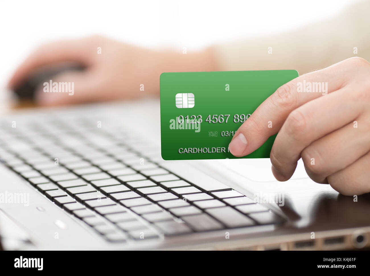 Man holding green payment card Stock Photo