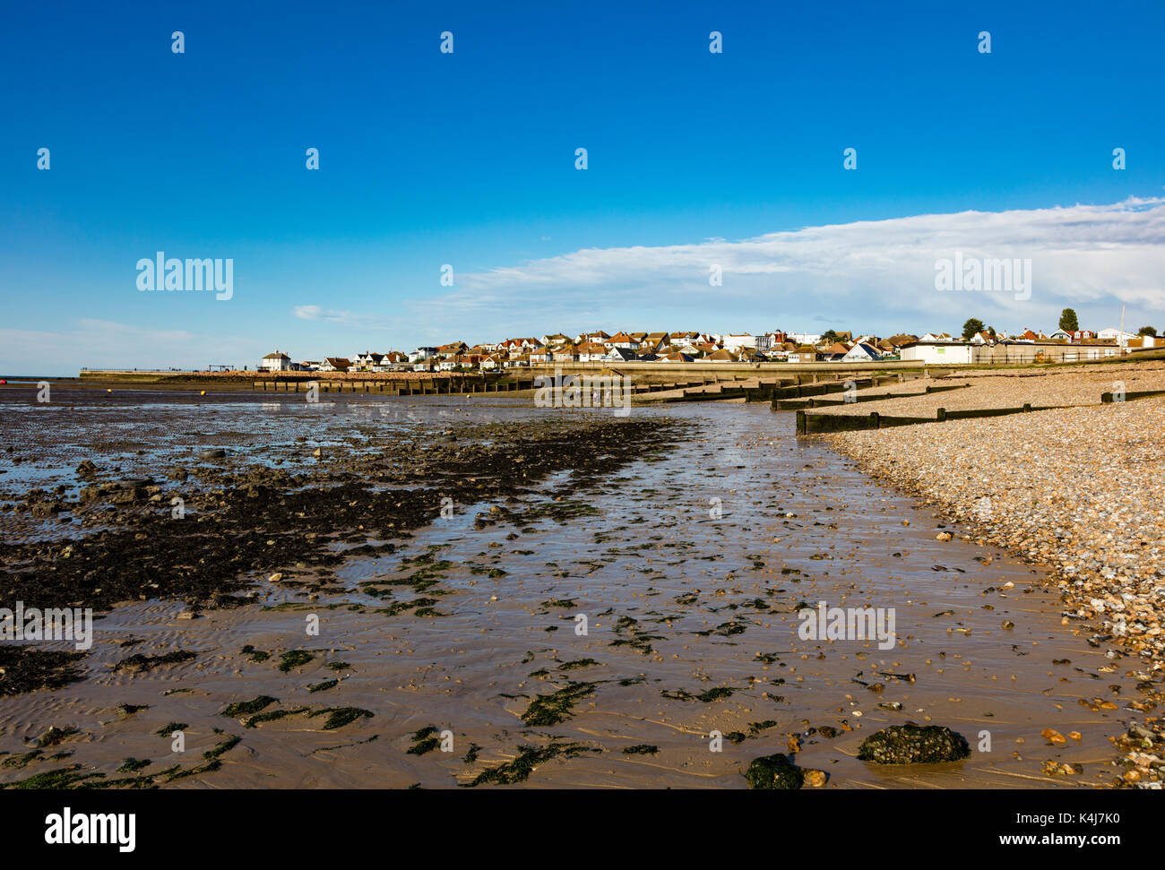 The houses of Hampton, Herne Bay in the low afternoon light at low tide