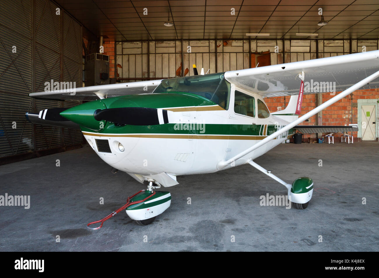 A small plane, parked in hangar airplane. Stock Photo