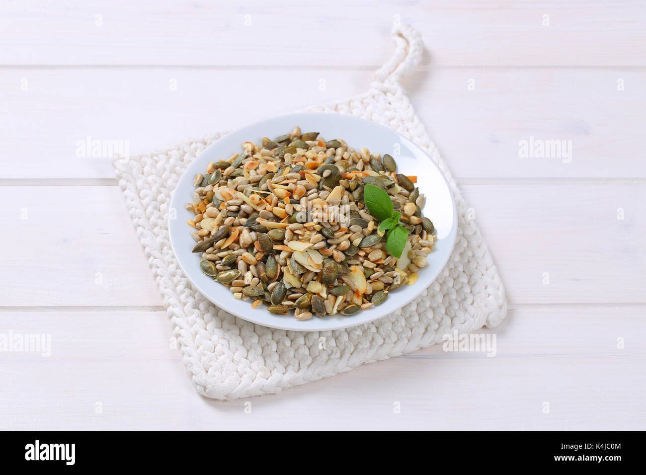 Mix of pumpkin and sunflower seeds with pine nuts and chopped almonds Stock Photo