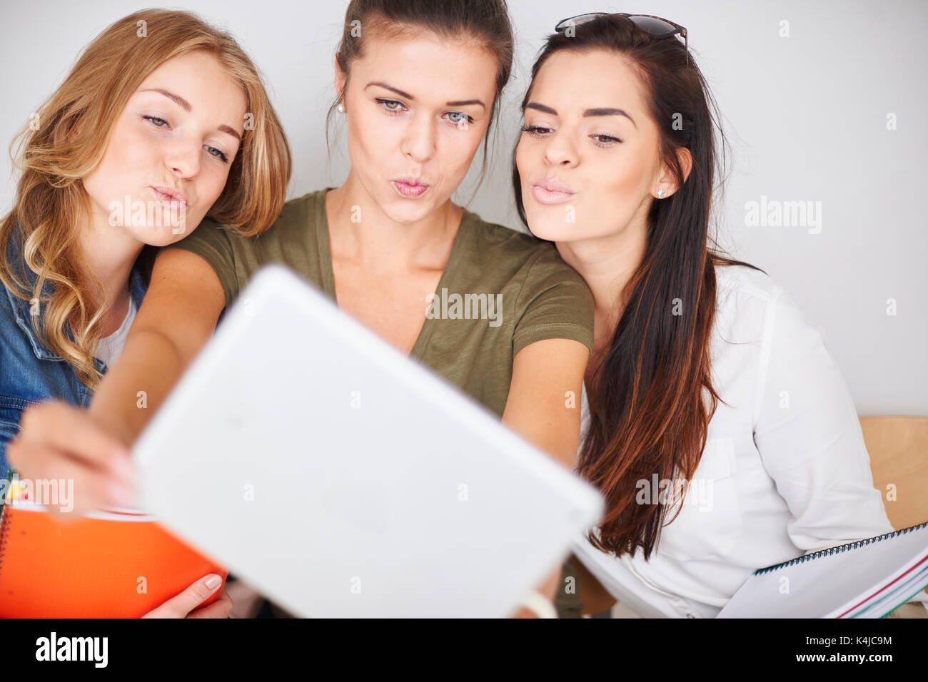 Sweet kisses from beautiful students Stock Photo