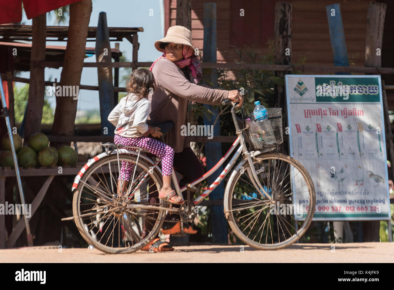 Woman with her daughter on bicycle, Siem Reap, Cambodia Stock Photo