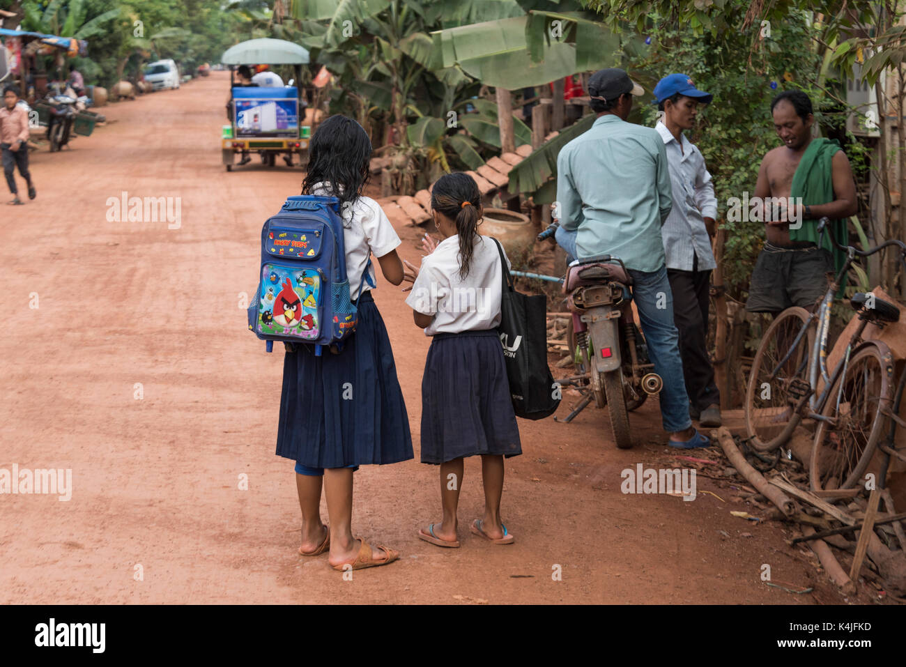 People standing on street in village, Siem Reap, Cambodia Stock Photo