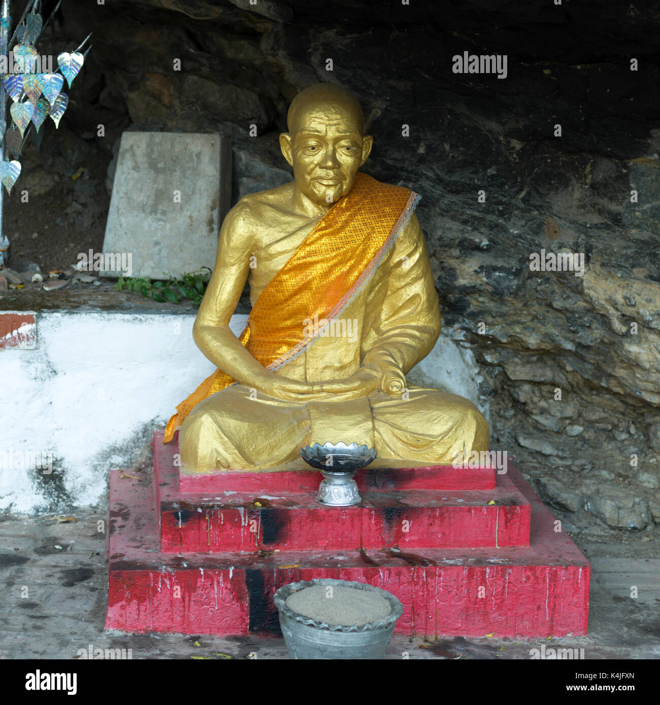 Golden statue in temple, Mount Phousi, Luang Prabang, Laos Stock Photo
