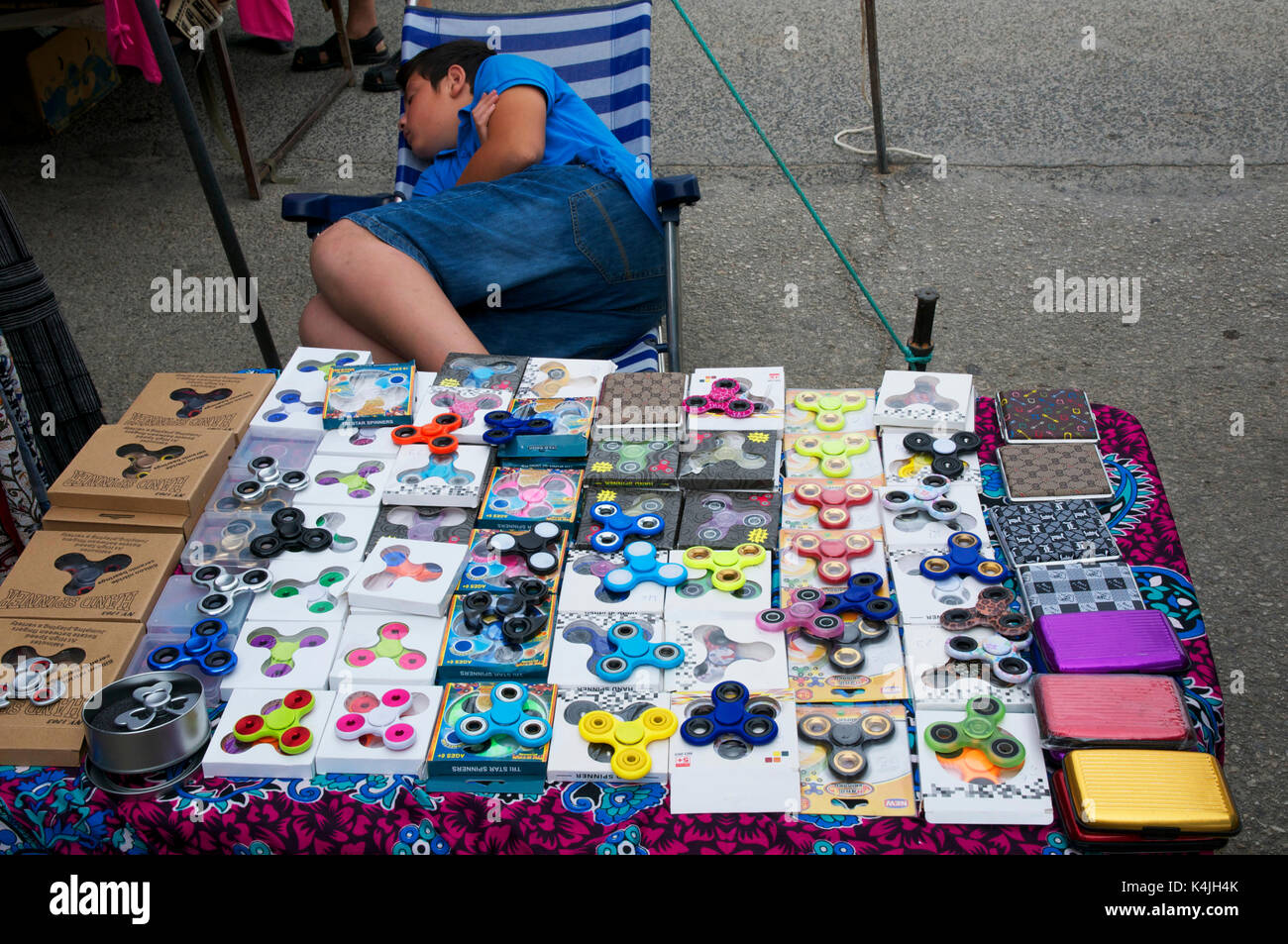 Sea fishing rods and reels for sale at a market stall Stock Photo