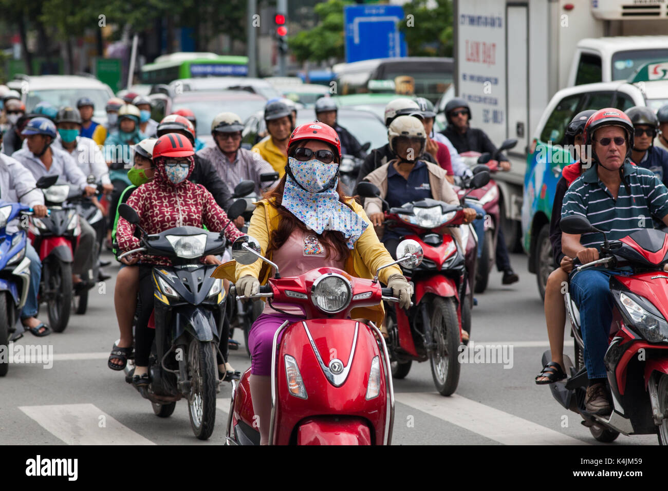 HO CHI MINH CITY (SAIGON), VIETNAM - JULY 2017 : Road traffic in Saigon, Vietnam. In the biggest city in Southern Vietnam are more than 4 mil. motorbi Stock Photo