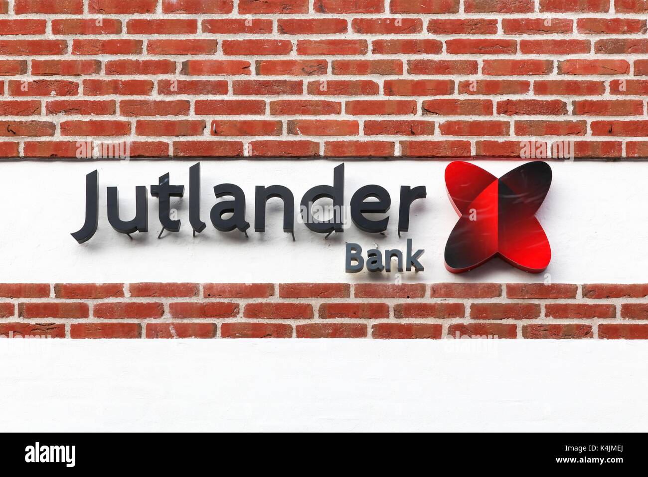 Logstor, Denmark - August 23, 2017: Jutlander Bank logo on a wall. Jutlander Bank is one the largest bank in Denmark measured on working capital Stock Photo
