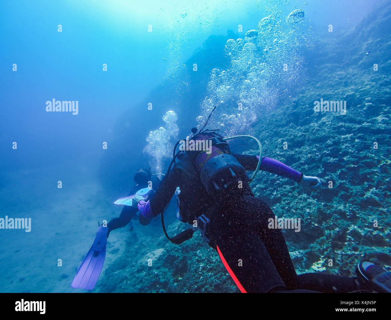 Scuba Divers And Air Bubbles Against The Sunlight Stock Photo