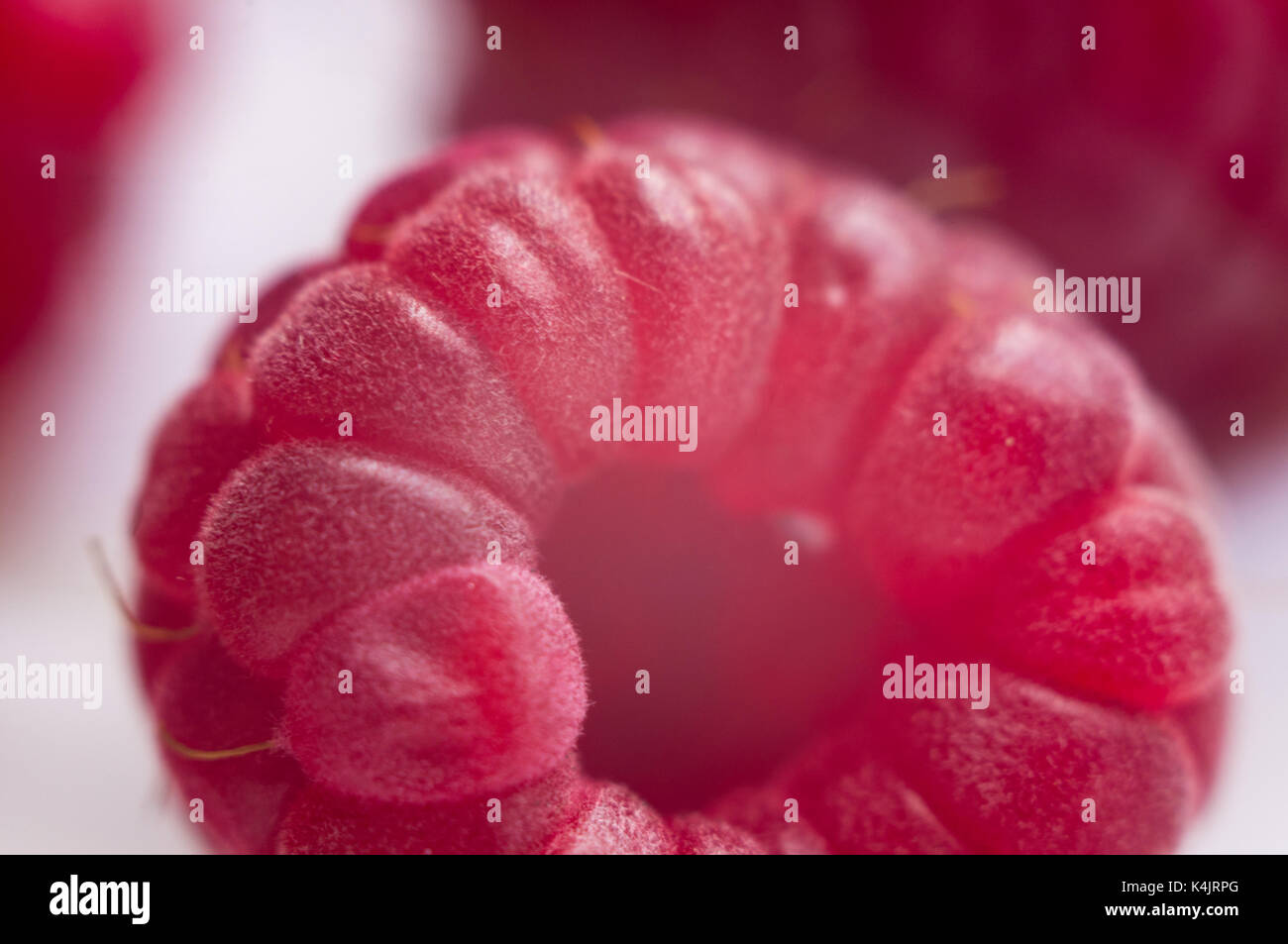 big fresh juicy raspberries on a white saucer close up, macro photo ...