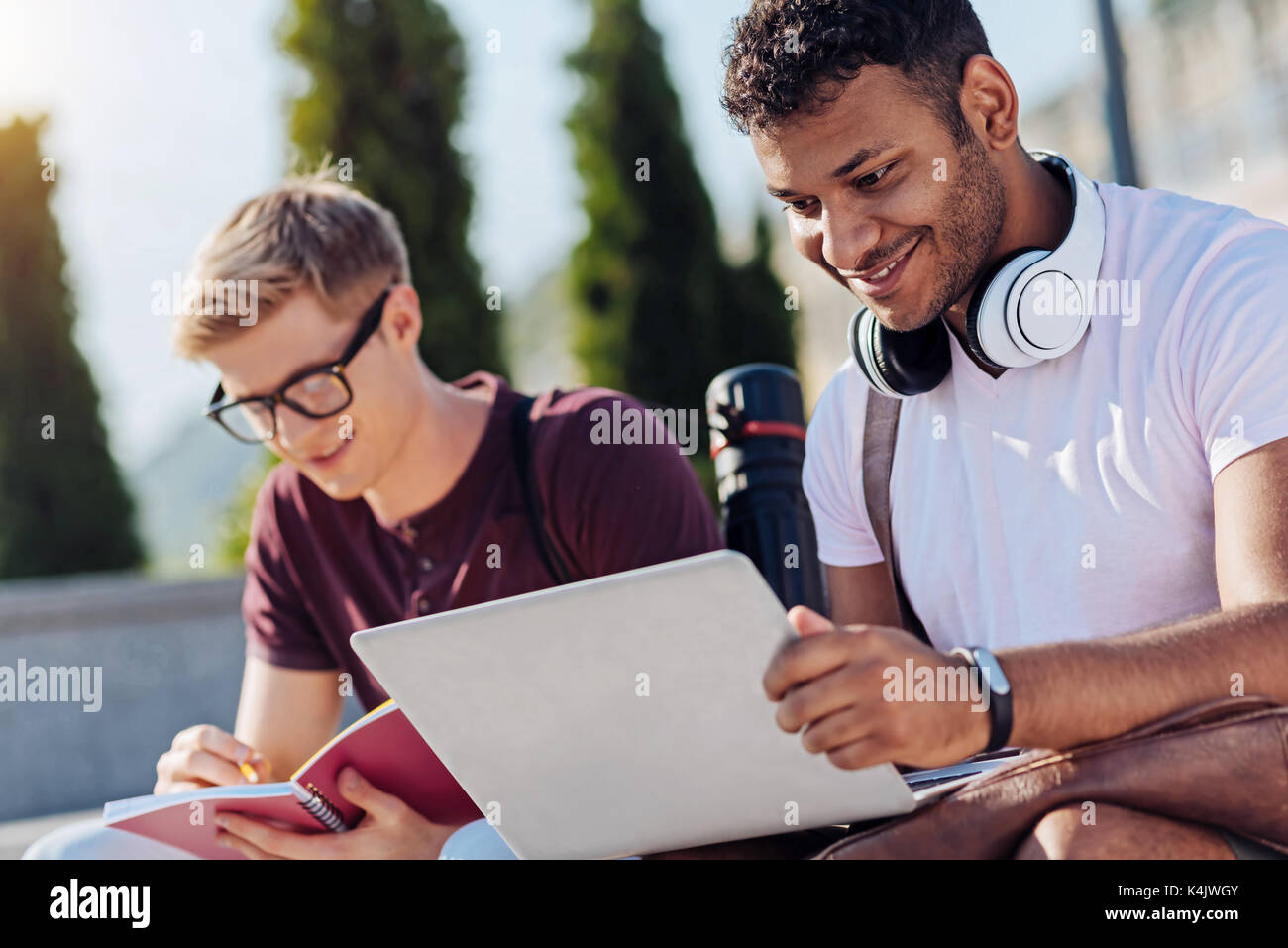 Delighted bearded man using his new laptop Stock Photo