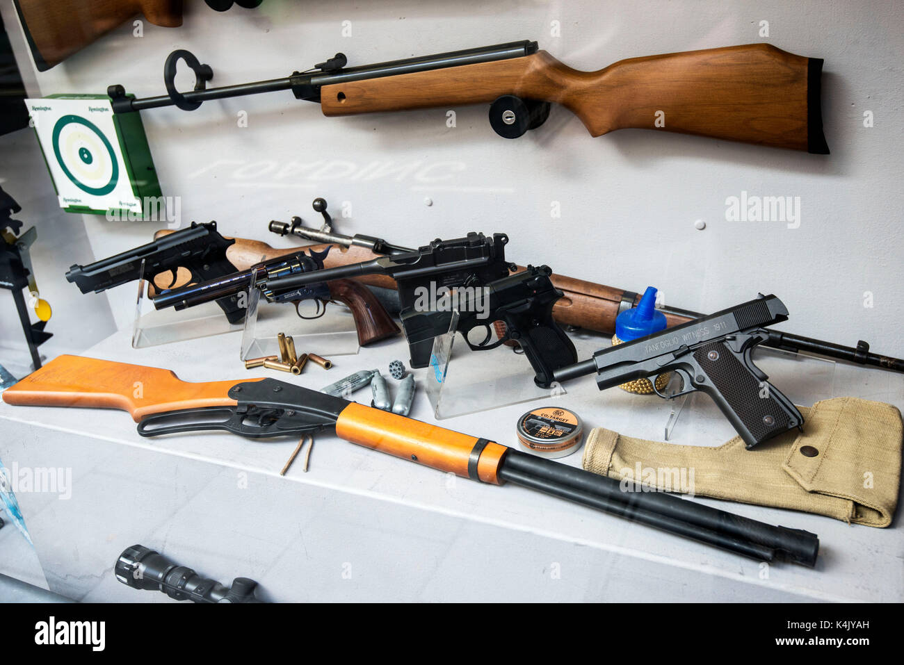 A selection of guns in a shop window in Brighton city centre. Credit: Terry Applin Stock Photo