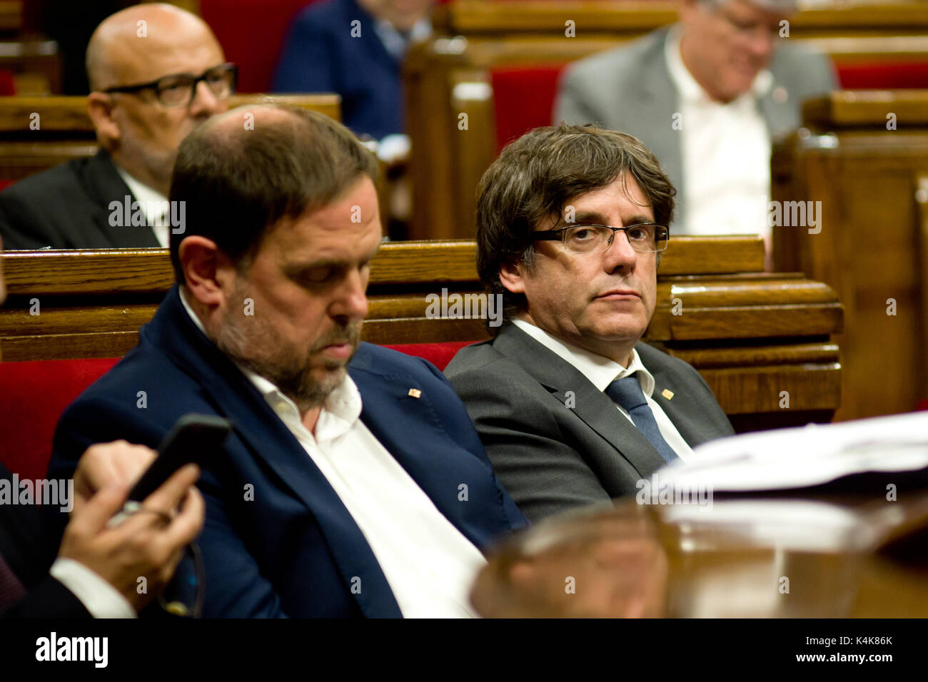 Barcelona, Catalonia, Spain. 6th Sep, 2017. Catalan regional president CARLES PUIGDEMONT (R) and catalan vice-president ORIOL JUNQUERAS (L) during the parliamentary session in the Catalonia Parliament. The Catalan Parliament has passed a law to call a referendum of independence the next first of October. The unionist forces of Catalonia and the Spanish government are frontally opposed to the referendum and consider it illegal. Credit: Jordi Boixareu/ZUMA Wire/Alamy Live News Stock Photo